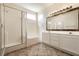 Bathroom with double vanity, tiled floors, and separate shower and tub at 9001 Picket Fence Ave, Las Vegas, NV 89143