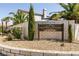 Attractive stone entry sign for Spring Mountain Ranch community amidst desert landscaping at 9001 Picket Fence Ave, Las Vegas, NV 89143