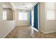 Bright dining room with neutral tones, tile flooring, and sliding glass doors with blue curtains at 9001 Picket Fence Ave, Las Vegas, NV 89143