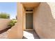 Welcoming front door with neutral paint and a small covered entryway at 9001 Picket Fence Ave, Las Vegas, NV 89143