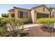 Charming single-story home with a well-manicured front yard and a two-car garage at 9001 Picket Fence Ave, Las Vegas, NV 89143