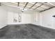 Spacious garage with white walls and ceiling, offering ample storage and parking at 9001 Picket Fence Ave, Las Vegas, NV 89143