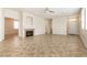 Spacious living room with tile flooring, a fireplace, and neutral paint at 9001 Picket Fence Ave, Las Vegas, NV 89143