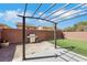 Backyard featuring covered patio with a grill and gravel landscaping at 9335 Tonkawa Ave, Las Vegas, NV 89178