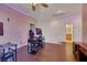 Upstairs bonus room, featuring hardwood floors, ceiling fan, and stylish LED lighting at 9335 Tonkawa Ave, Las Vegas, NV 89178