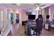 Spacious upstairs bonus room with hardwood floors, ceiling fan, stylish LED lighting, and TV at 9335 Tonkawa Ave, Las Vegas, NV 89178
