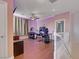 Upstairs bonus room with hardwood floors, ceiling fan, and stylish LED lighting at 9335 Tonkawa Ave, Las Vegas, NV 89178