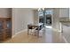 Dining room with hardwood floors, a chandelier, and a sliding glass door at 9335 Tonkawa Ave, Las Vegas, NV 89178