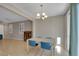 Dining room with hardwood floors and a modern chandelier at 9335 Tonkawa Ave, Las Vegas, NV 89178