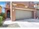A close-up view of the garage with lights over it and the house number displayed at 9335 Tonkawa Ave, Las Vegas, NV 89178