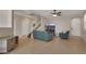 A living room with hardwood floors, neutral-colored walls, and a ceiling fan at 9335 Tonkawa Ave, Las Vegas, NV 89178