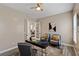 Comfortable office space with chairs and a contemporary desk, connecting to other rooms at 9421 Queen Charlotte Dr, Las Vegas, NV 89145