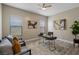 Comfortable office space with sofa, arm chairs, desk and contemporary decor at 9421 Queen Charlotte Dr, Las Vegas, NV 89145