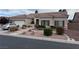 Charming single-story home featuring a well-manicured front yard and a two-car garage at 10023 Liberty View Rd, Las Vegas, NV 89148