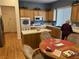 Functional kitchen with wooden cabinets, island, and a breakfast nook perfect for casual dining at 10023 Liberty View Rd, Las Vegas, NV 89148