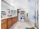 Bright bathroom featuring double sinks with wooden vanity and a shower-tub combination at 10143 Canyon Hills Ave, Las Vegas, NV 89148