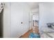 Light-filled bedroom showcasing wood floors and closet space at 10143 Canyon Hills Ave, Las Vegas, NV 89148