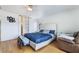 Spacious bedroom featuring a modern bed frame, hardwood floors and a ceiling fan at 10143 Canyon Hills Ave, Las Vegas, NV 89148