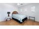 Cozy bedroom with wood floors, windows, and neutral decor at 10143 Canyon Hills Ave, Las Vegas, NV 89148