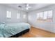Bedroom with a bed, hardwood floors, and ample natural light at 10143 Canyon Hills Ave, Las Vegas, NV 89148