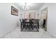 Contemporary dining room with modern chandelier and elegant black and white rug at 10143 Canyon Hills Ave, Las Vegas, NV 89148