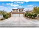 Charming two-story home with a spacious driveway and an attached two-car garage at 10143 Canyon Hills Ave, Las Vegas, NV 89148