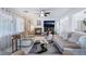 Cozy living room featuring a fireplace, ceiling fan and natural light at 10143 Canyon Hills Ave, Las Vegas, NV 89148