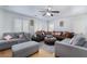 Cozy living room with ceiling fan and comfortable seating, perfect for relaxing at 10143 Canyon Hills Ave, Las Vegas, NV 89148