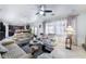 Bright living room open to kitchen, features comfortable seating, and large windows with natural light at 10143 Canyon Hills Ave, Las Vegas, NV 89148