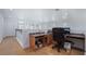 Bright open loft with built-in desk area and light-colored laminate floors at 10143 Canyon Hills Ave, Las Vegas, NV 89148
