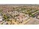 Expansive aerial view of a residential area with homes, trees, and distant city views showcasing community living at 10276 Cherry Brook St, Las Vegas, NV 89183