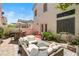 Inviting backyard featuring a paved patio with a lounge area and outdoor bar with a grill, perfect for entertaining at 10276 Cherry Brook St, Las Vegas, NV 89183