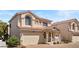 Two-story home featuring a two-car garage, cozy front porch and terracotta tile roof in a desirable location at 10276 Cherry Brook St, Las Vegas, NV 89183