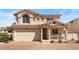 Charming two-story home featuring a red tile roof, a two-car garage, and a cozy front porch at 10276 Cherry Brook St, Las Vegas, NV 89183