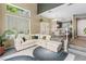 Bright living room featuring vaulted ceilings, large windows, modern furnishings, and stylish decor at 10276 Cherry Brook St, Las Vegas, NV 89183