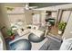 Open-concept living room with a view of kitchen and dining area, and with a large sectional sofa at 10276 Cherry Brook St, Las Vegas, NV 89183