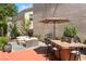 Outdoor patio with bar seating, built-in grill and comfortable outdoor furniture set at 10276 Cherry Brook St, Las Vegas, NV 89183