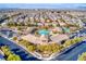 Beautiful aerial showcasing a pool, clubhouse, and stunning views of this vibrant and well-maintained neighborhood at 10631 Kennedy Peak Ln, Las Vegas, NV 89166