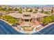 The well-maintained community center is surrounded by lush trees and desert landscaping at 10631 Kennedy Peak Ln, Las Vegas, NV 89166