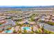 The community center has a pool and is surrounded by lush landscaping in this beautiful aerial shot at 10631 Kennedy Peak Ln, Las Vegas, NV 89166