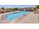 A swimming pool is equipped with lane markers and is surrounded by lounge chairs for relaxing in the sun at 10631 Kennedy Peak Ln, Las Vegas, NV 89166