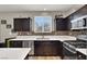Close-up of a kitchen featuring sleek countertops, stainless steel appliances, and stylish cabinetry at 10631 Kennedy Peak Ln, Las Vegas, NV 89166