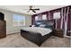 Spacious main bedroom with a large bed, stylish accents, and ample natural light at 10631 Kennedy Peak Ln, Las Vegas, NV 89166