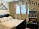 Bedroom featuring double bed, neutral walls, ceiling fan, and natural light at 1121 Majestic Canyon St, Henderson, NV 89052