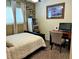 Neutral bedroom, a ceiling fan, double bed, and small desk and chair at 1121 Majestic Canyon St, Henderson, NV 89052