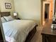 Bedroom with full bed and nightstand and warm neutral-colored walls at 1121 Majestic Canyon St, Henderson, NV 89052