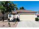 Charming single-story home with a tile roof, well-maintained landscaping, and a spacious driveway at 1121 Majestic Canyon St, Henderson, NV 89052