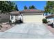 Attractive single-story home with a tile roof, a spacious driveway, and well-maintained landscaping at 1121 Majestic Canyon St, Henderson, NV 89052