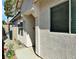 Exterior view of home showcasing stucco walls and mature landscaping at 1121 Majestic Canyon St, Henderson, NV 89052