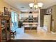 Bright kitchen with white cabinets, stainless steel appliances, and a center island with wine rack at 1121 Majestic Canyon St, Henderson, NV 89052